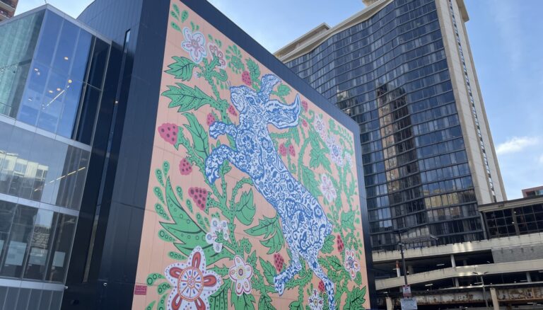 Chicago murals: Giant floral bunny tangles with thorn branches over Wabash Arts Corridor